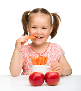 child eating healthy snack