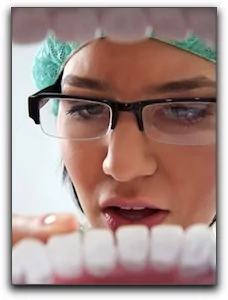 image of a dental assistant from the perspective of inside a patients mouth