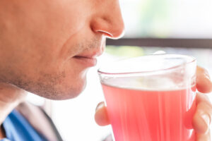 man preparing to drink alcohol