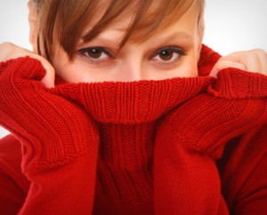 Woman hiding face because of chronic bad breath!