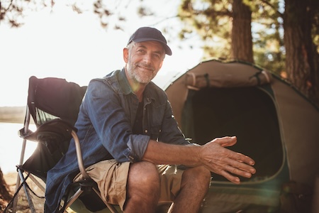 Man sitting happily because of new implants in Marble Falls near Brady, TX