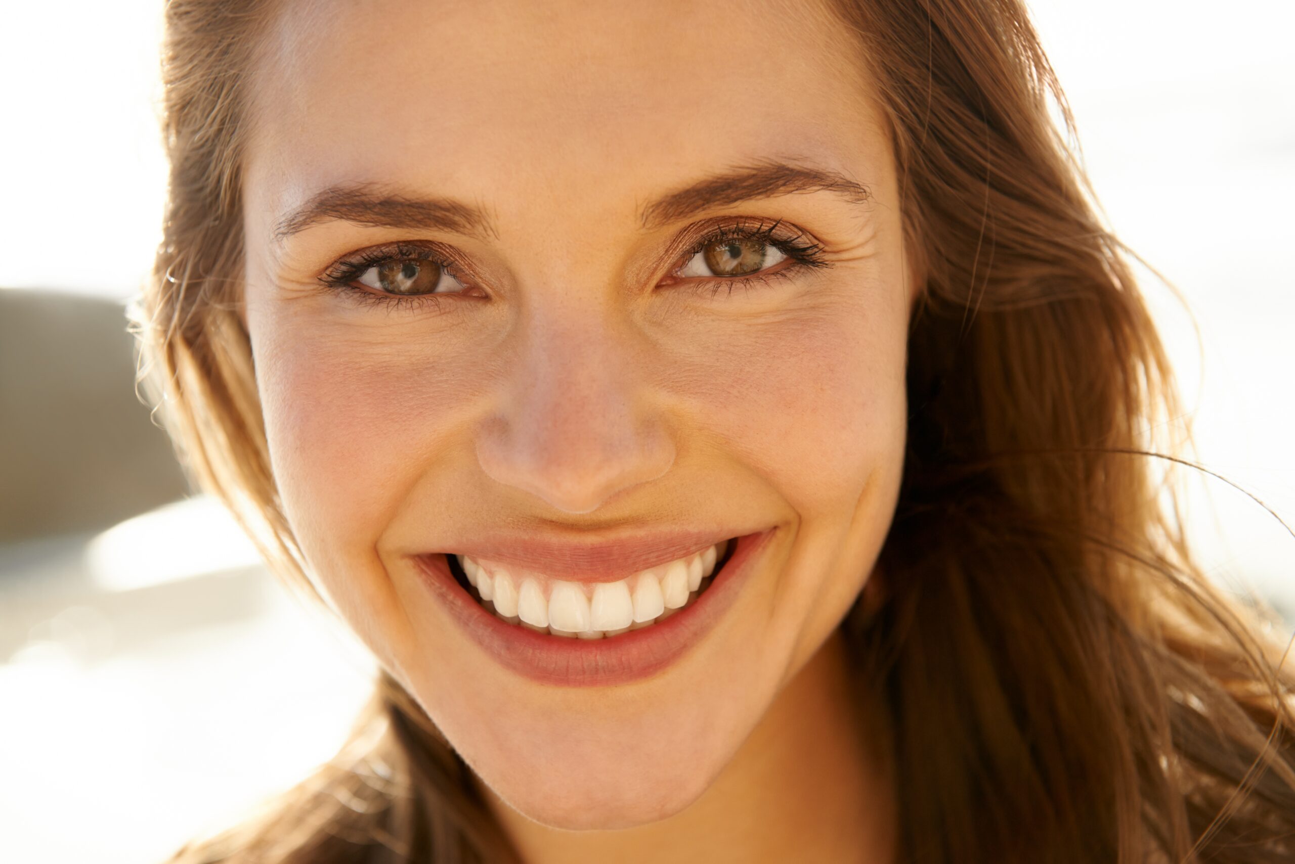 closeup of an attractive woman smiling, cosmetic dentistry